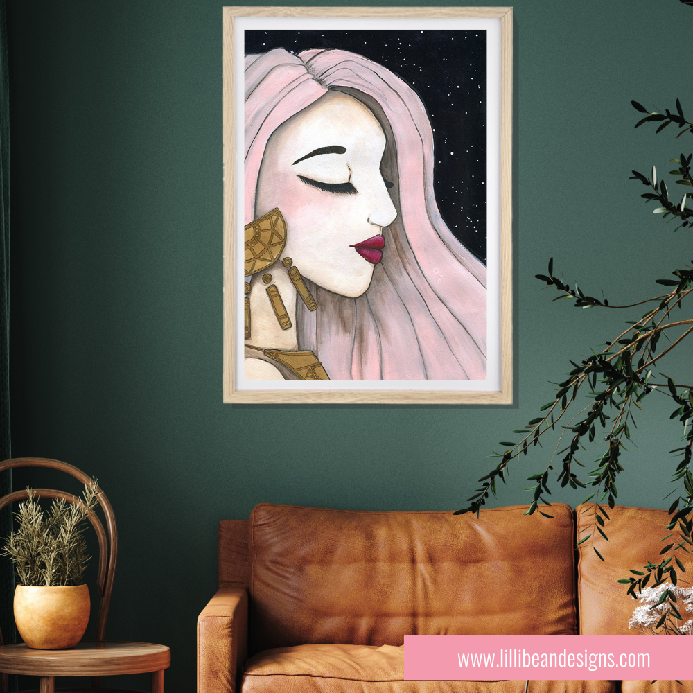 Framed artwork of a stylized face on a green wall above a brown leather sofa.