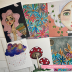 Collection of illustrated cards featuring various designs on a wooden surface.