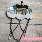 Decorative cloud-shaped hooks with illustrations on a wooden surface, labeled with caravan image. LilliBean Designs