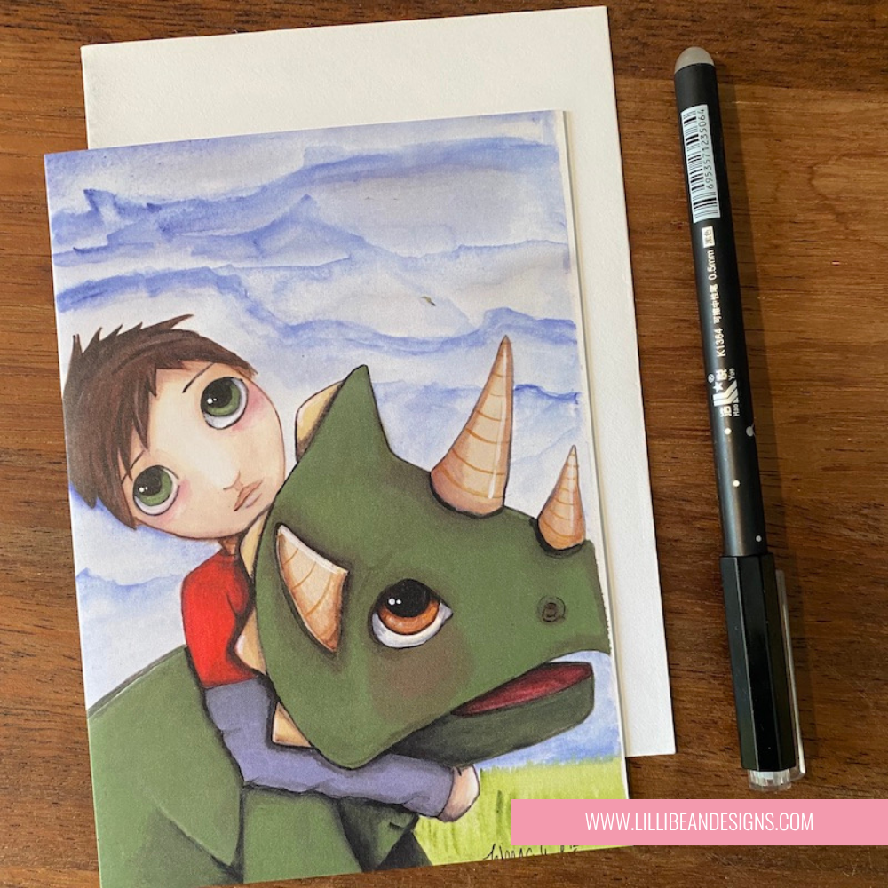 Illustration of a boy holding a dinosaur with a pen on a wooden surface GREETING CARD