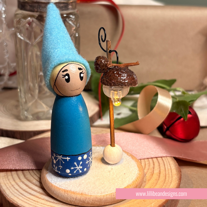 Blue Elf with a namdmade light that is on