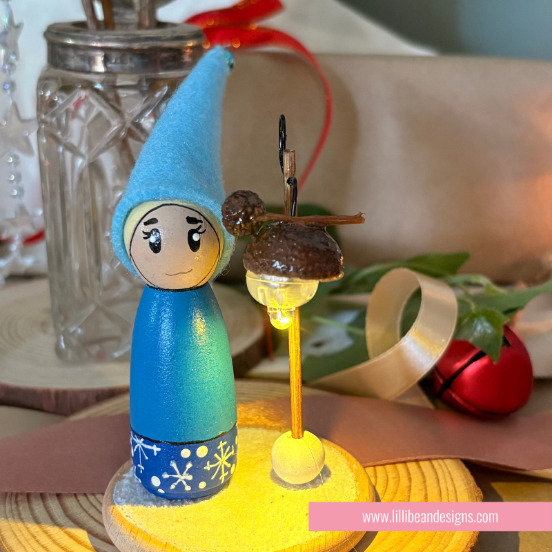 Blue Elf with a namdmade light that is on