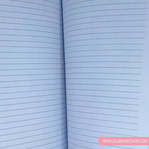 Open notebook with lined pages on a light blue background
