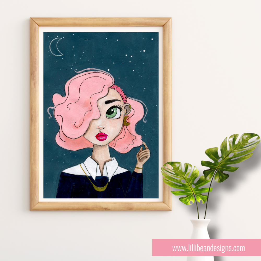 Framed illustration of a woman with pink hair against a starry night sky, next to a plant on a white wall.