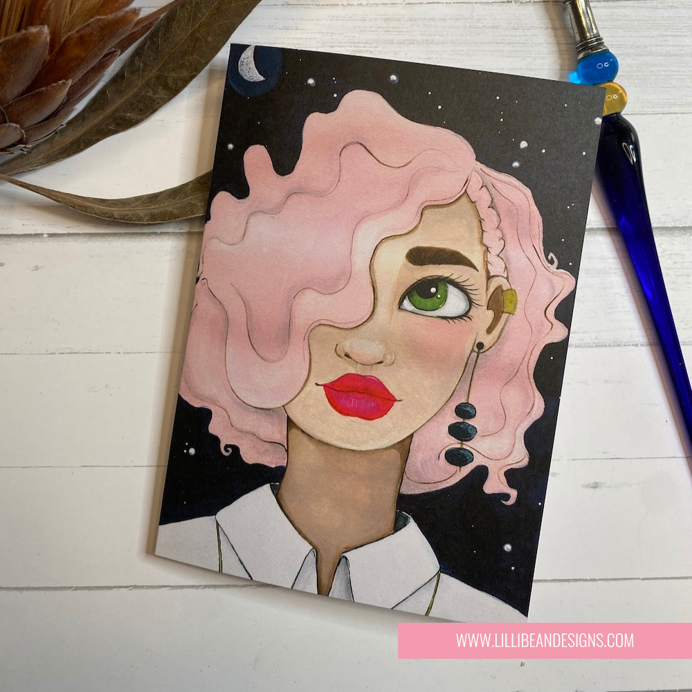 Illustration of a woman with pink hair and red lipstick on a black background, with a pen and plant in the background. GREETING CARD