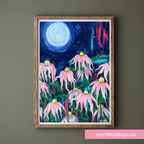 Framed artwork of pink flowers under a night sky with a full moon on a green wall.
