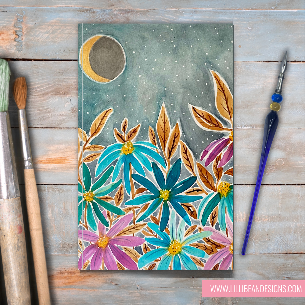 Floral painting on a wooden surface with art supplies