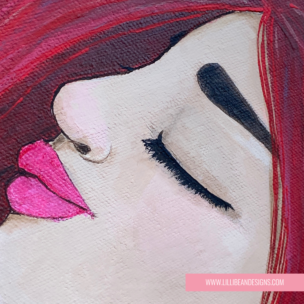 close up of artwork of a woman with red hair 
