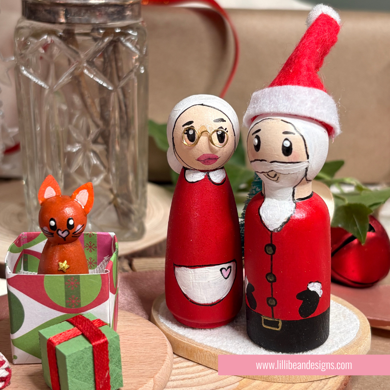 mr and mrs claus with ginger cat handpainted wooden dolls