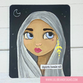 Illustration of a woman with white hair and blue eyes, wearing a yellow earring, on a black background with text 'Spirit heals all'.