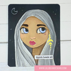 Illustration of a woman with white hair and blue eyes, wearing a yellow earring, on a black background with text 'Spirit heals all'.