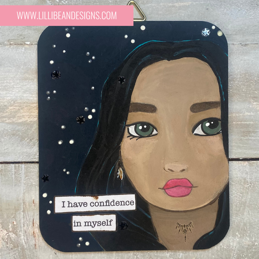 Artistic depiction of a woman's face with a motivational quote on a wooden background, featuring the artist's website.