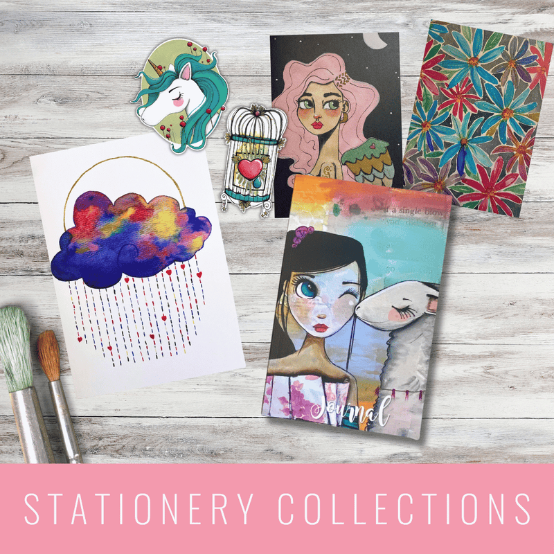 Collection of artistic stationery items on a wooden surface with 'Stationery Collections' text. LilliBean Designs