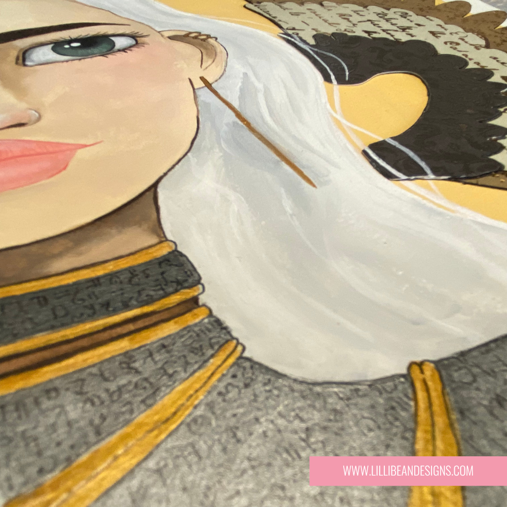 close up artwork of a woman with a decorative angel wing on a yellow background, displayed on a shelf.