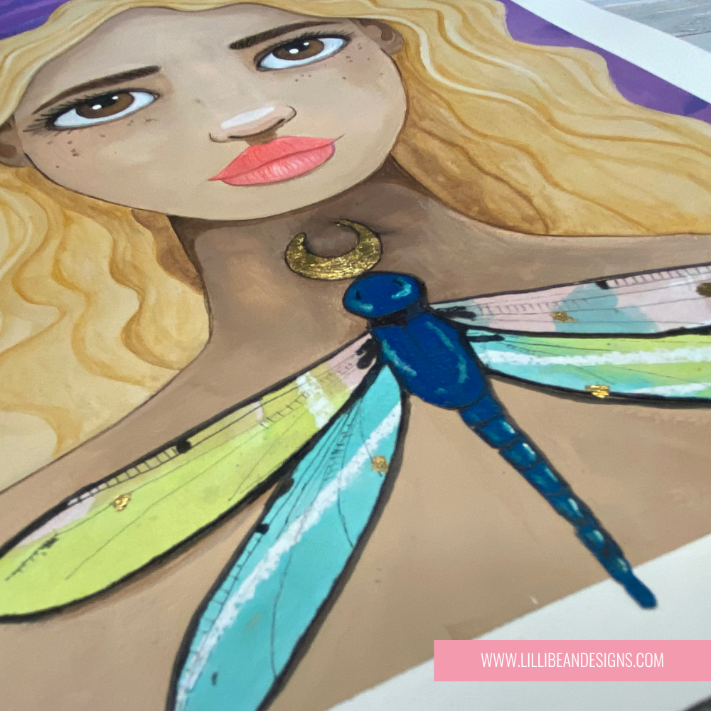 Illustration of a fairy with dragonfly wings and a crescent moon necklace, featuring LillieBee Designs branding.