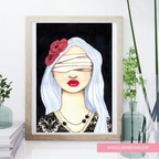 A framed art print featuring a stylized illustration of a woman with white hair, red flowers, and red lips against a black background, displayed on a shelf with decorative plants and books.