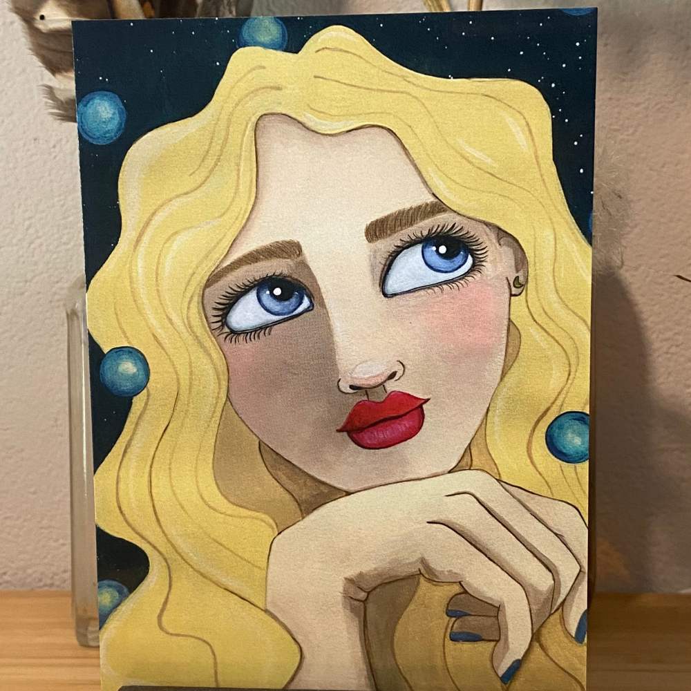 Artistic depiction of a woman with blonde hair and blue eyes, surrounded by celestial elements.