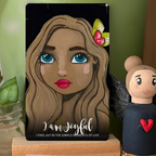 Card with a stylized illustration of a woman's face and text 'I am joyful' next to a small figurine.