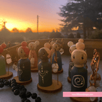 Collection of small figurines with a sunset background