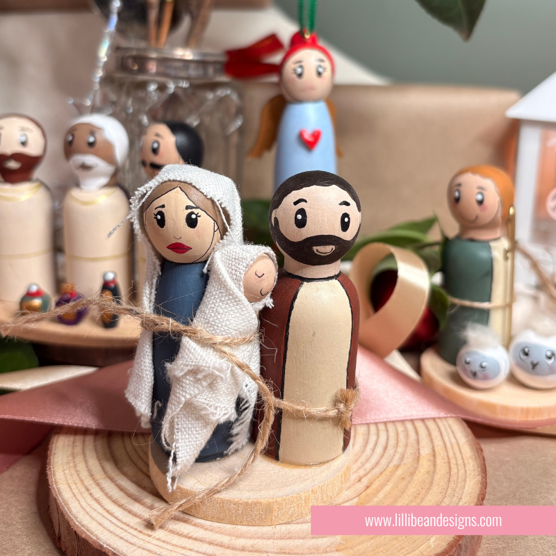 nativity scene of handpainted wooden dolls the holy family, three kings, shepherd and ange;