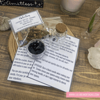 Witchcraft supplies including crystals, herbs, and a bottle on a wooden surface with Lillie Bean Designs branding.