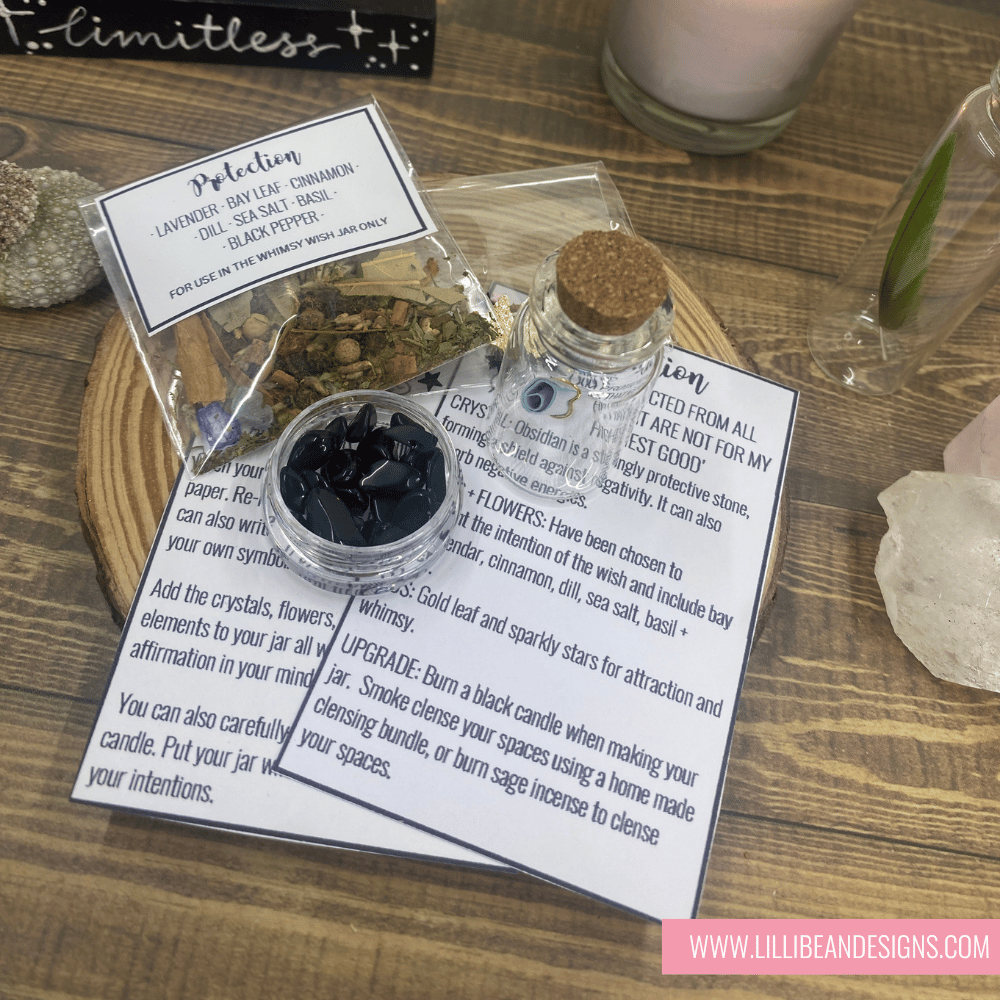 Witchcraft supplies including crystals, herbs, and a bottle on a wooden surface with Lillie Bean Designs branding.