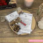 Packaged product with cards on a wooden surface, featuring 'Confidence + Courage' theme. MAGICAL WISH KIT