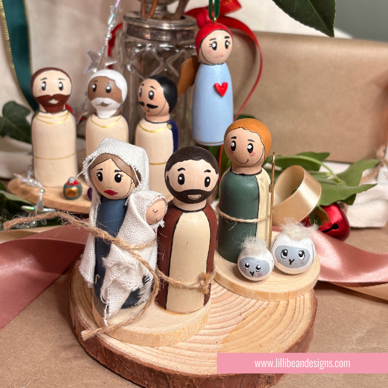 nativity scene of handpainted wooden dolls the holy family, three kings, shepherd and ange;