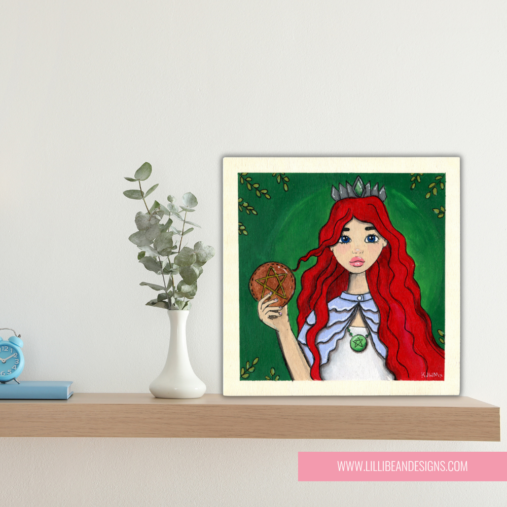 Framed artwork of a character with red hair and a green background on a shelf.