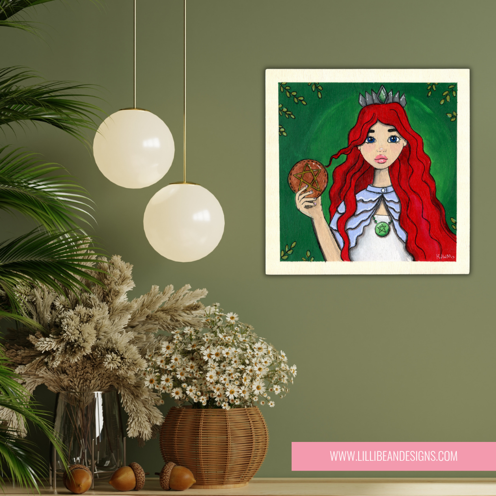 Framed artwork of a red-haired woman with a green background on a wall with decorative plants and lights.