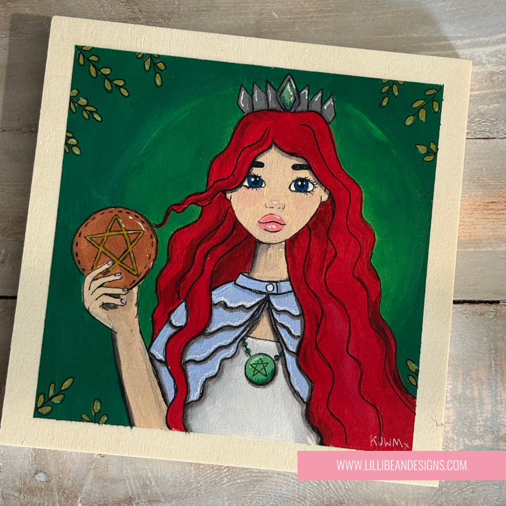 Artistic depiction of a woman with red hair holding a pentacle, on a green background with a wooden frame.