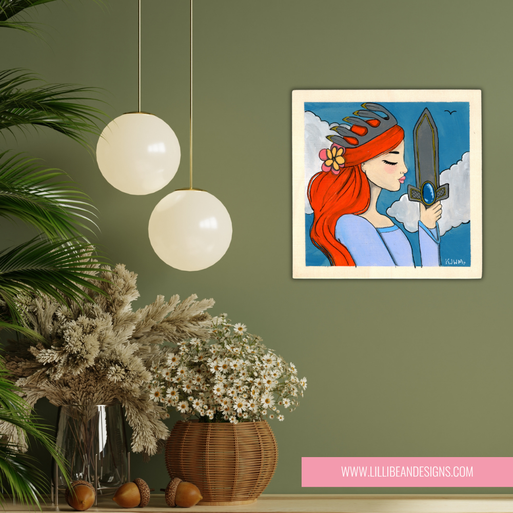 Framed artwork of a woman with red hair and a sword on a green wall, with decorative plants and lights.