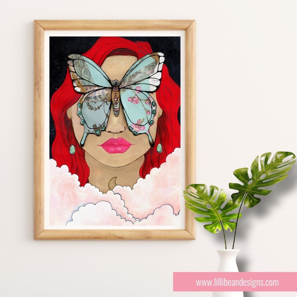 Framed artwork of a woman with red hair and a butterfly on her face, next to a plant.