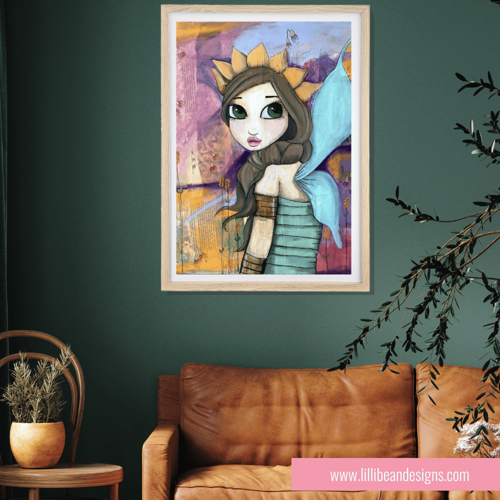 Framed artwork of a fairy character on a green wall above a brown leather sofa.