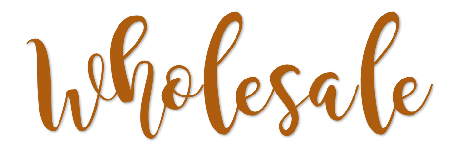 The word 'wholesale' written in a cursive, gold font on a white background LilliBean Designs